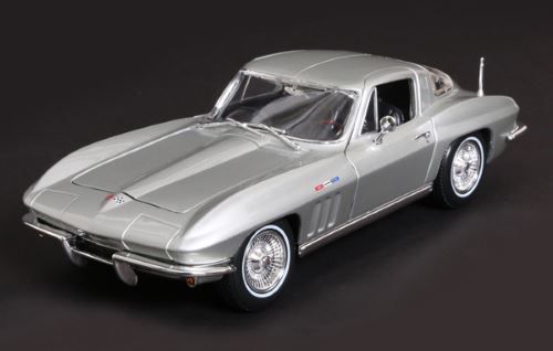 Maisto 1:18 1965 Chevrolet Corvette metallic silver diecast model top down angle on dark background
