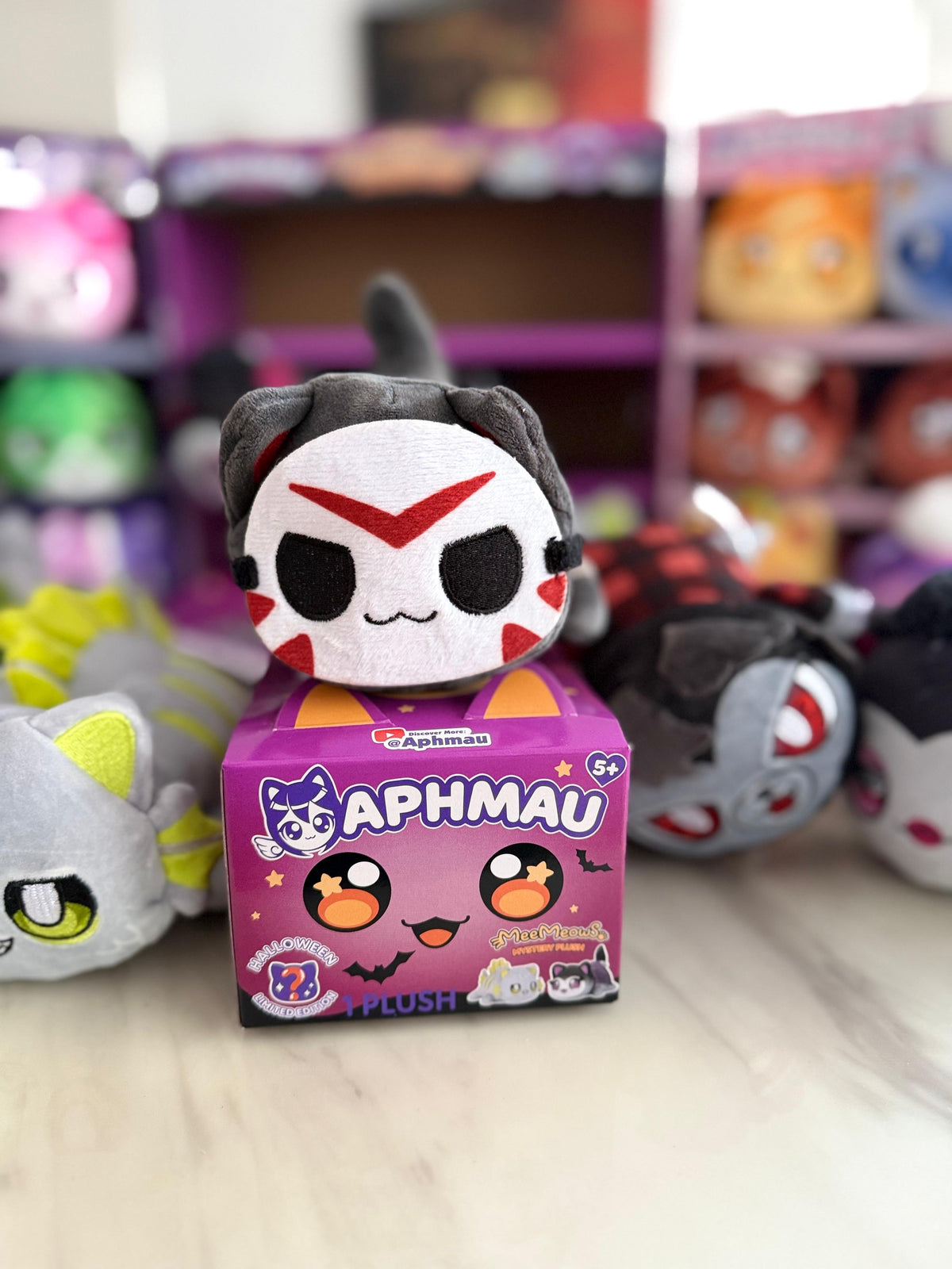 Aphmau Hockey Mask Cat Halloween plush displayed with its purple box