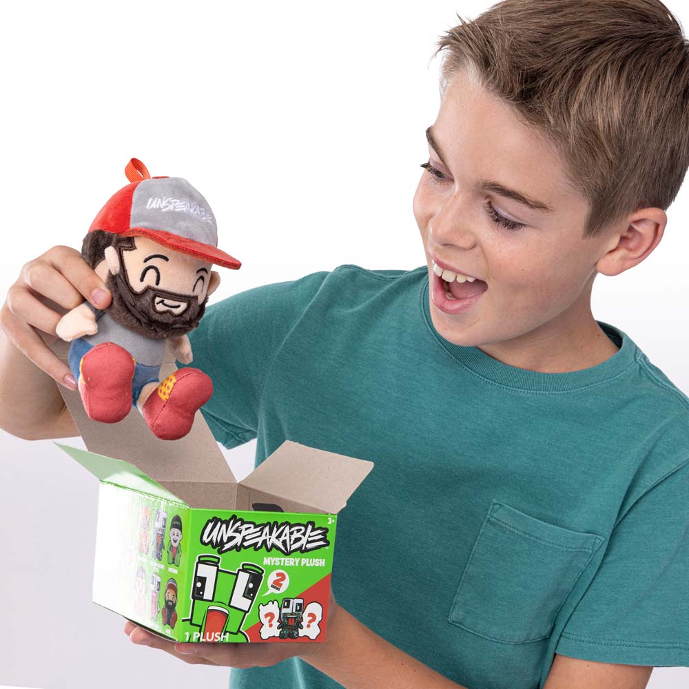 Boy unboxing Unspeakable Mystery Plush Series 2 blind box
