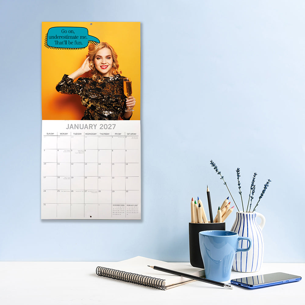 Bitchy Talk 2027 Square Wall Calendar – January 2027 lifestyle shot featuring a woman in a sequin dress with the quote Go on, underestimate me. That'll be fun.