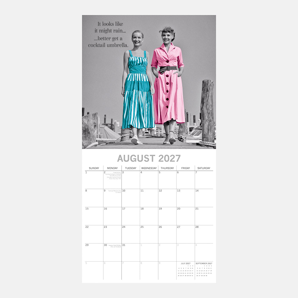Women's Wit 2027 Calendar – August 2027 page featuring two stylish women in teal and pink dresses with quote It looks like it might rain better get a cocktail umbrella