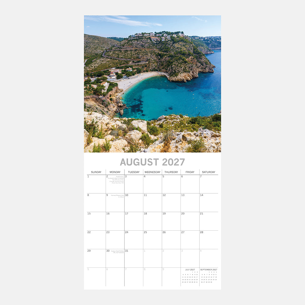 Mediterranean 2027 Square Wall Calendar - August 2027 month page with aerial view of a secluded turquoise cove on the Spanish coast