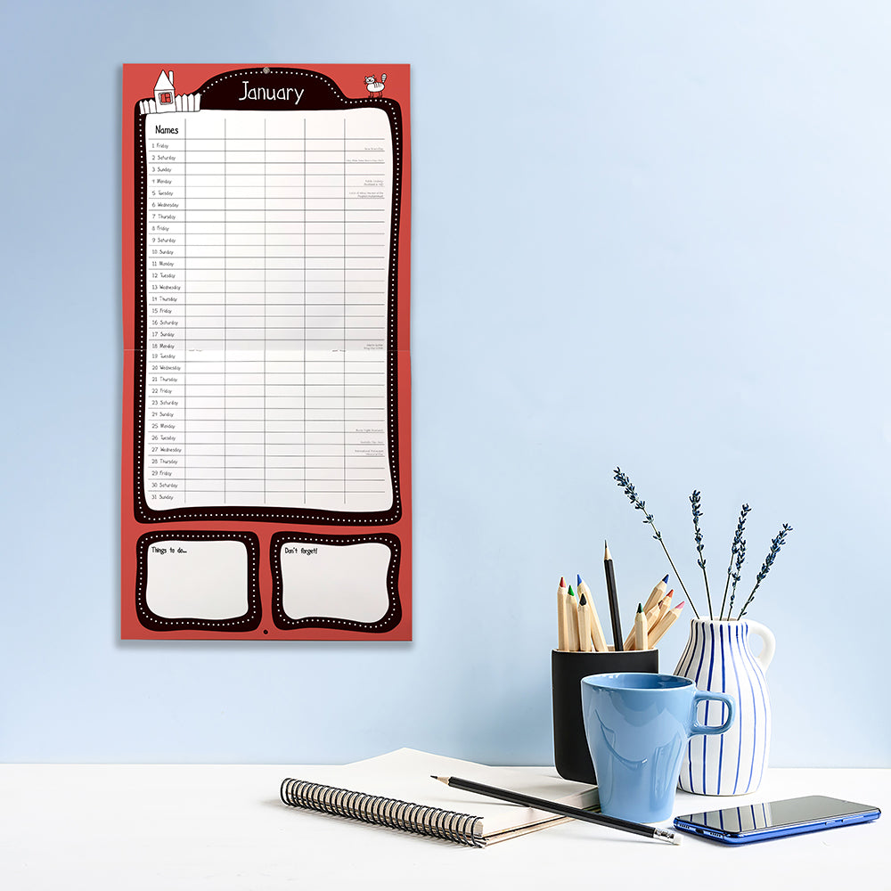 Home Organiser 2027 Square Wall Calendar – January 2027 lifestyle shot showing 5-column family organiser on red background displayed on a home office wall with stationery