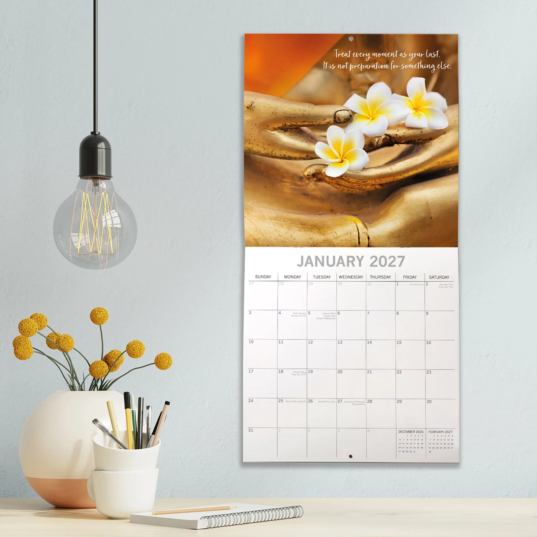 Zen 2027 Square Wall Calendar - January 2027 lifestyle shot hung on wall above a styled home office desk