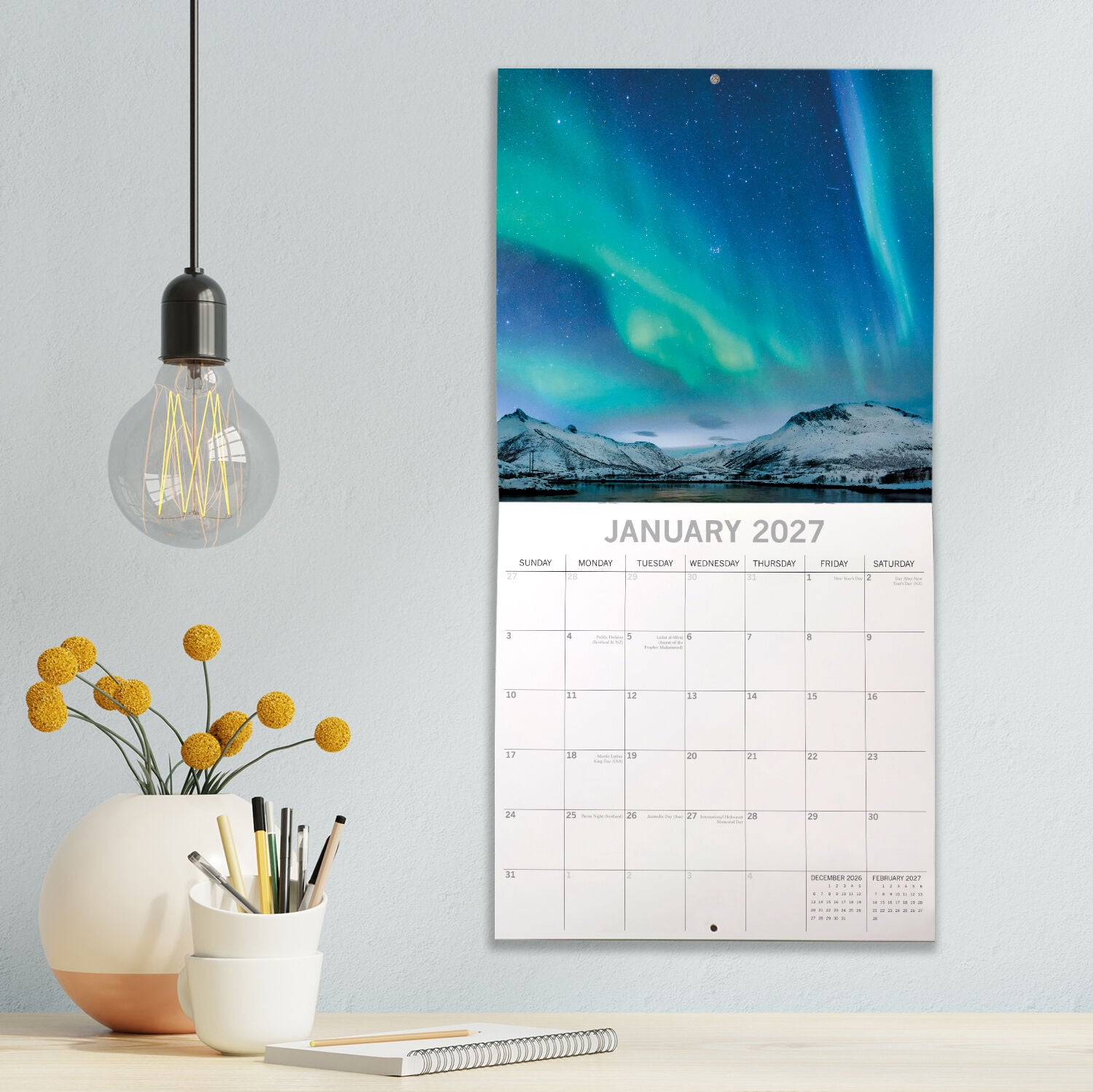 Northern Lights 2027 Square Wall Calendar – front cover featuring vivid green Aurora Borealis swirling over snow-capped Norwegian fjord mountains