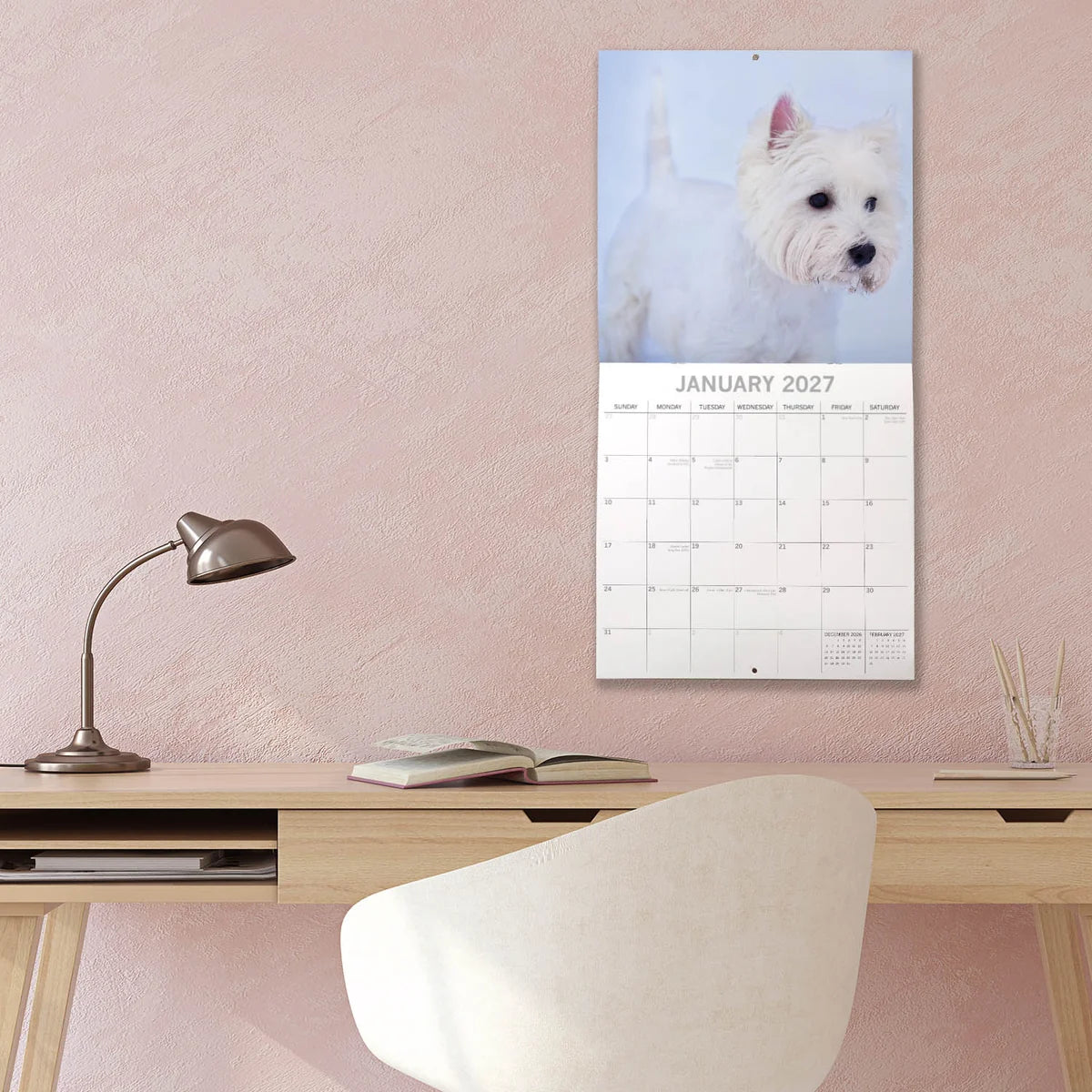 West Highland White Terriers 2027 Calendar - lifestyle shot hung on wall showing January 2027 page with Westie in snow