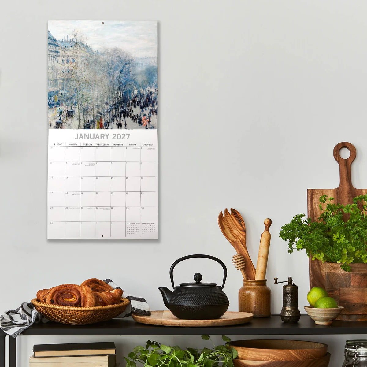 Monet 2027 Square Wall Calendar – January 2027 lifestyle shot in kitchen setting