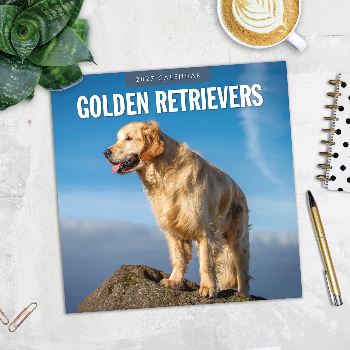Golden Retrievers 2027 Square Wall Calendar - Lifestyle flat lay with coffee, succulent and stationery on marble surface