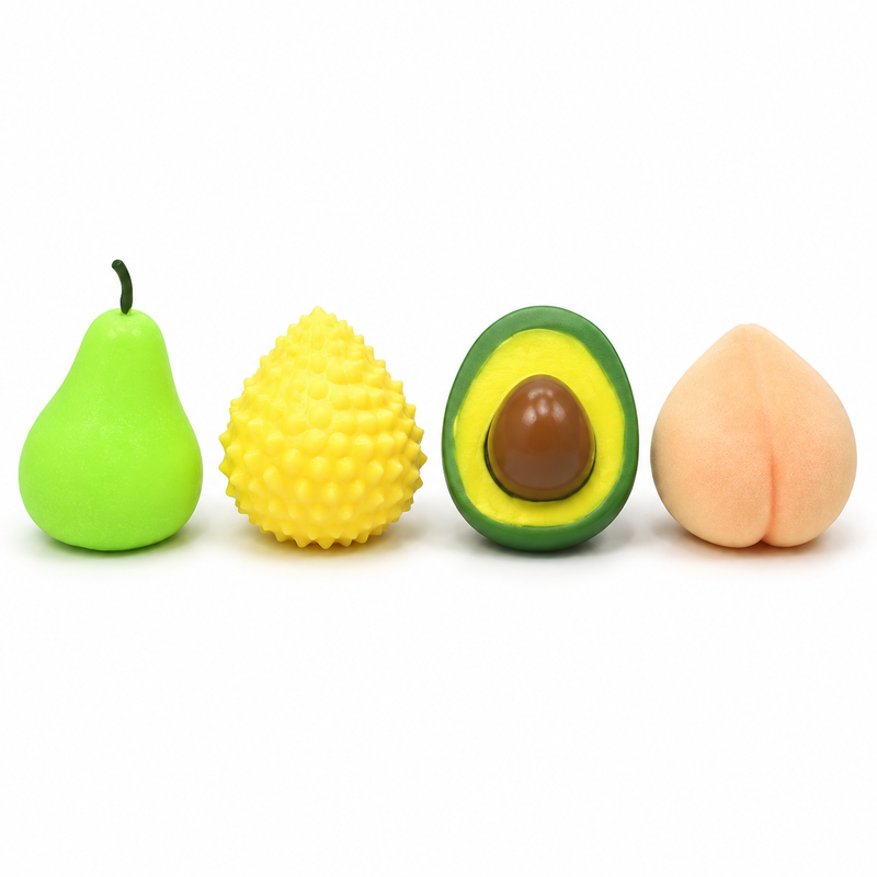 Set of 4 Fruit Squishy Toys - Pear, Jackfruit, Avocado and Peach on white background