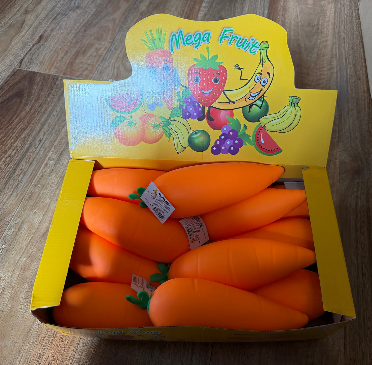 Carrot squishy toys in a yellow Mega Fruit display box
