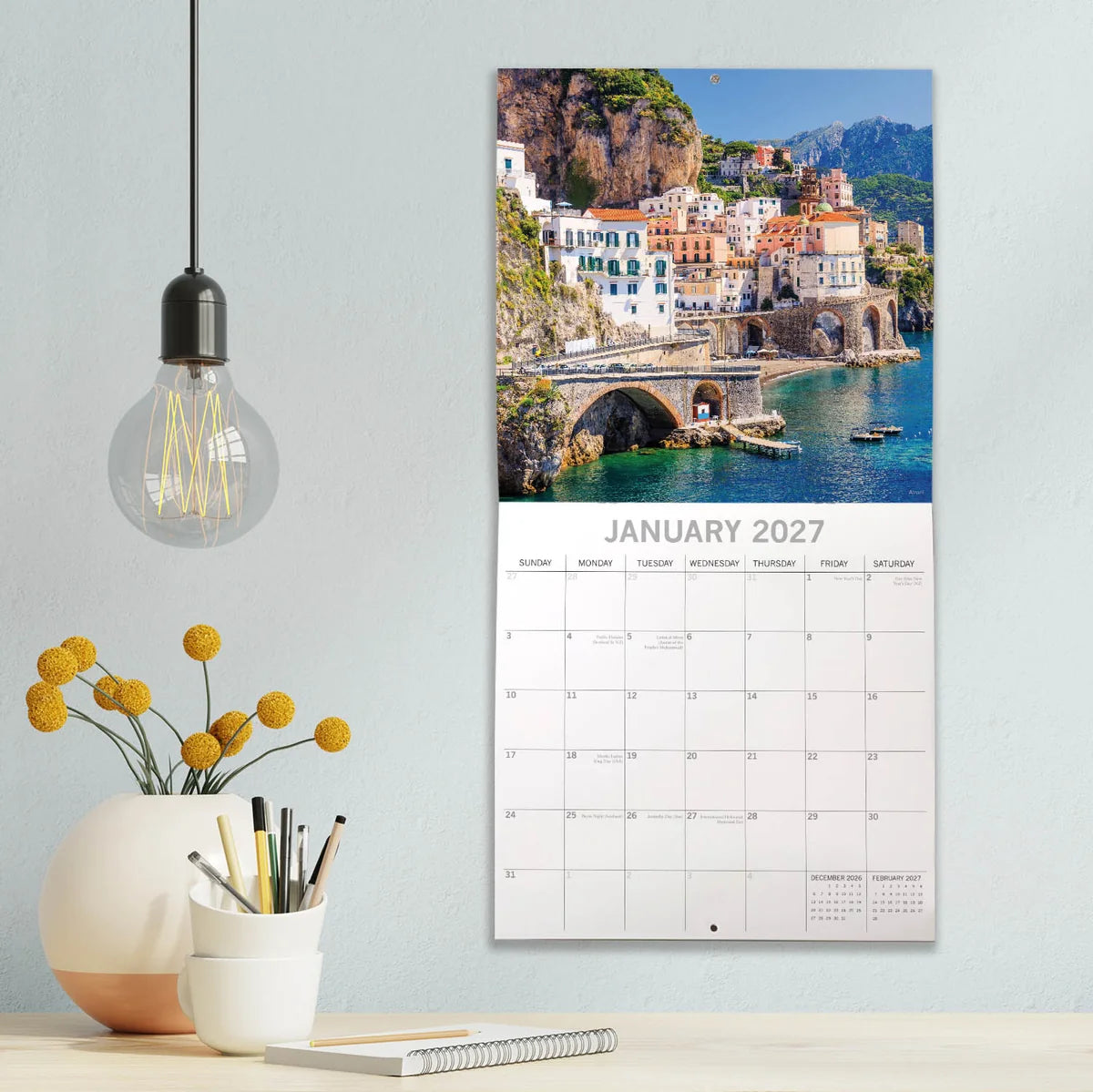 Italy 2027 Square Wall Calendar – January 2027 lifestyle shot featuring Atrani on the Amalfi Coast displayed on a modern wall