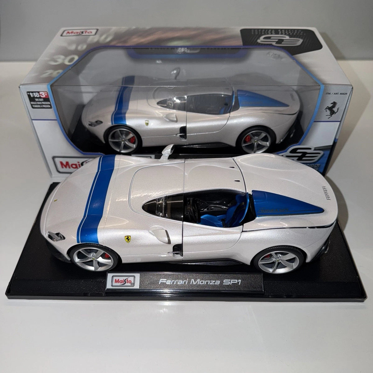 Maisto Ferrari Monza SP1 white model car on display base with Special Edition packaging behind it