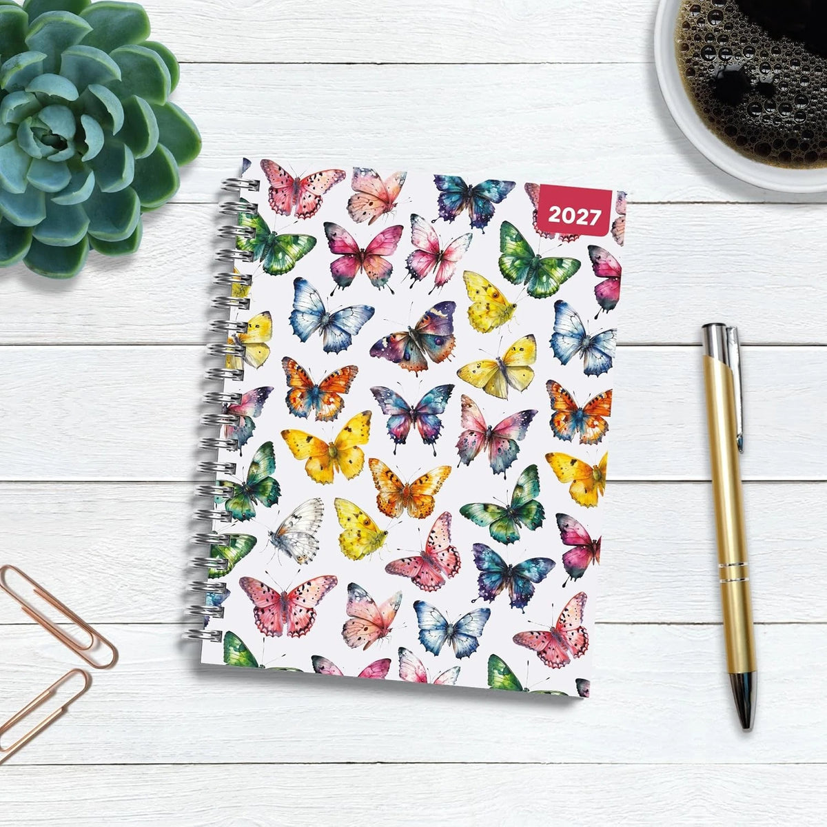 Butterflies 2027 A5 Spiral Diary front cover on desk with succulent plant, coffee and pen