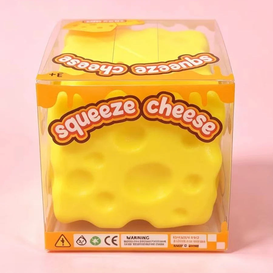 Squeeze Cheese squishy toy in clear display packaging box